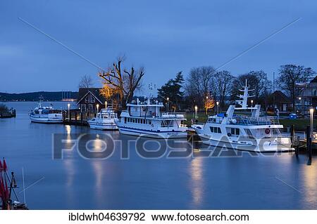 Stock Image - Baltic Sea harbour with boats at dusk, Niendorf, Timmendorfer Strand, Bay of Lübeck, Schleswig-Holstein, Germany, Europe. Fotosearch