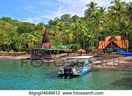 Stock Image - Bay with palm beach and beach bar of the Anse Chastenet Hotel, Soufriere, St. Lucia, Lesser Antilles, West Indies, Caribbean Islands. Fotosearch