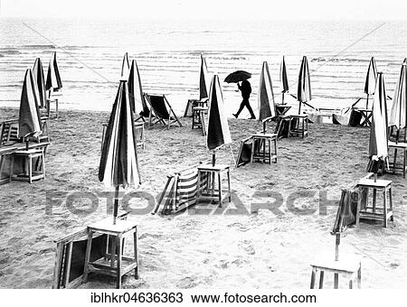 Beach in the rain, ca. 1970s, exact place unknown, Germany, Europe View Large Photo Image Stock Image - Beach in the rain, ca. 1970s, exact place unknown, Germany, Europe. Fotosearch