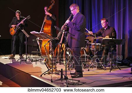 Bigband, Gerold Heitbaum Quartet on stage, Bendix Maeder on saxophone, Wittenberg, Saxony-Anhalt, Germany, Europe View Large Photo Image Stock Image - Bigband, Gerold Heitbaum Quartet on stage, Bendix Maeder on saxophone, Wittenberg, Saxony-Anhalt, Germany, Europe. Fotosearch