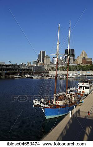 Blue sailboat in harbour, Old Port, Montreal, Quebec Province, Canada, North America View Large Photo Image Picture - Blue sailboat in harbour, Old Port, Montreal, Quebec Province, Canada, North America. Fotosearch