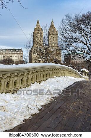Bow Bridge with San Remo building in Central Park, New York City, USA, North America View Large Photo Image Stock Image - Bow Bridge with San Remo building in Central Park, New York City, USA, North America. Fotosearch