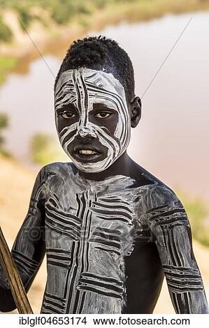 Picture - Boy from the Karo tribe, about 12 years, with body painting, Omo River, Southern Nations Nationalities and Peoples' Region, Ethiopia, Africa. Fotosearch