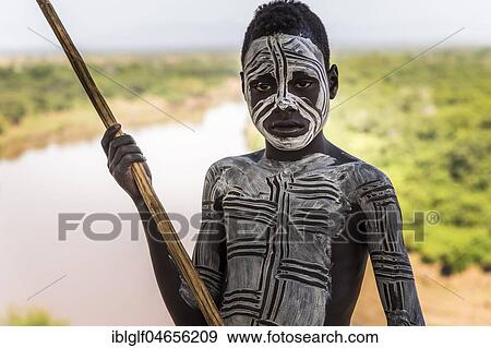 Boy from the Karo tribe, about 12 years, with body painting, Omo River, Southern Nations Nationalities and Peoples' Region, Ethiopia, Africa View Large Photo Image Stock Photo - Boy from the Karo tribe, about 12 years, with body painting, Omo River, Southern Nations Nationalities and Peoples' Region, Ethiopia, Africa. Fotosearch
