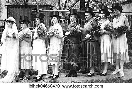 Stock Image - Bride with bridesmaids with cylinder, 1930s, Germany, Europe. Fotosearch