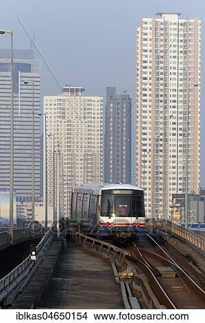 BTS Skytrain in front of skyscrapers, on Saphan Taksin Bridge, Sathon, Bangkok, Thailand, Asia View Large Photo Image Picture - BTS Skytrain in front of skyscrapers, on Saphan Taksin Bridge, Sathon, Bangkok, Thailand, Asia. Fotosearch