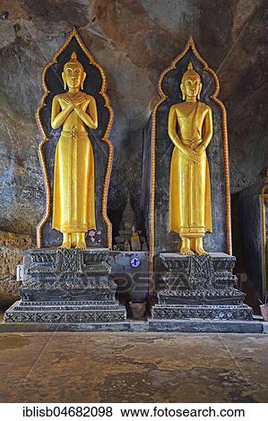 Stock Photo - Buddha statues in the cave temple Wat Tham Suwan Khuha, Phang Nga, Thailand, Asia. Fotosearch