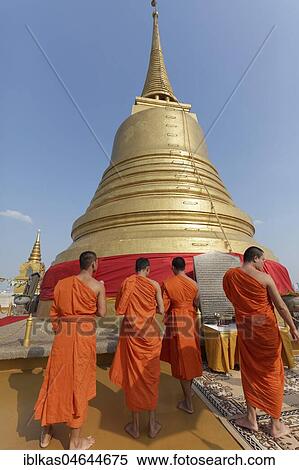 Buddhist monks in front of the Chedi on Phu Khao Thong, Golden Mountain, in Wat Sakret, Pom Prap Sattru Phai District, Bangkok, Thailand, Asia View Large Photo Image Stock Photography - Buddhist monks in front of the Chedi on Phu Khao Thong, Golden Mountain, in Wat Sakret, Pom Prap Sattru Phai District, Bangkok, Thailand, Asia. Fotosearch