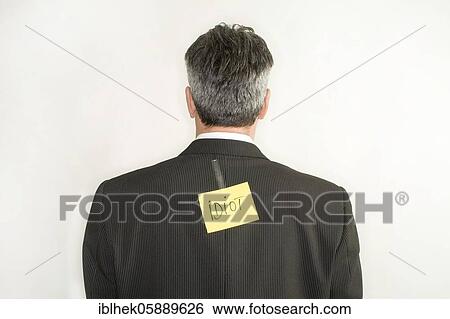 Bullying, businessman with note on back, idiot, mean, Berlin, Germany, Europe View Large Photo Image Stock Photograph - Bullying, businessman with note on back, idiot, mean, Berlin, Germany, Europe. Fotosearch