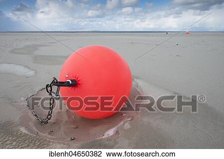 Buoy on the beach in the sand, Langeoog, North Sea, East Frisia, Lower Saxony, Germany, Europe View Large Photo Image Stock Image - Buoy on the beach in the sand, Langeoog, North Sea, East Frisia, Lower Saxony, Germany, Europe. Fotosearch