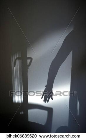 Stock Image - Burglar, door, shadow, creepy, Berlin, Germany, Europe. Fotosearch
