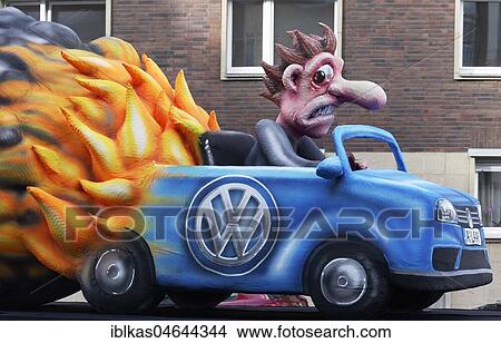 Burning VW car with monkey in exhaust gas cloud, exhaust gas scandal, animal testing with exhaust fumes, motto caravan during Carnival Monday procession 2018, Düsseldorf, North Rhine-Westphalia, Germany, Europe View Large Photo Image Picture - Burning VW car with monkey in exhaust gas cloud, exhaust gas scandal, animal testing with exhaust fumes, motto caravan during Carnival Monday procession 2018, Düsseldorf, North Rhine-Westphalia, Germany, Europe. Fotosearch