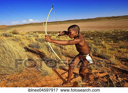 Stock Photo - Bushman of the San people hunting,! Xaus Lodge, Kalahari or Kglagadi Transfrontier Park, Northern Cape, South Africa, Africa. Fotosearch