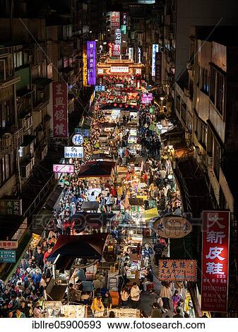 Stock Image - Busy pedestrian area at night, night market Raohe Night Market, Songshan District, Taipei, Taiwan, Asia. Fotosearch