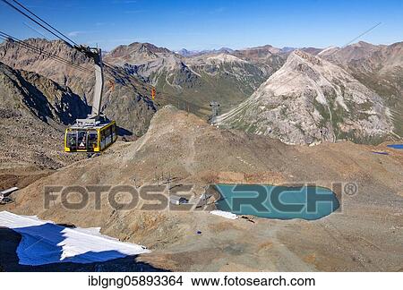Cable car to Diavolezza with mountain lake, Pontresina, Bernina Alps, Upper Engadine, Engadine, Grisons, Switzerland, Europe View Large Photo Image Picture - Cable car to Diavolezza with mountain lake, Pontresina, Bernina Alps, Upper Engadine, Engadine, Grisons, Switzerland, Europe. Fotosearch