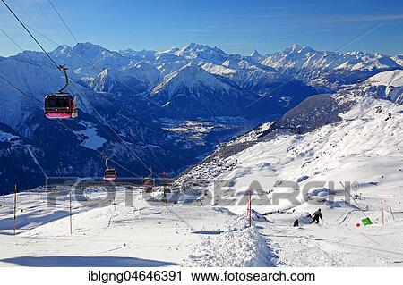 Stock Image - Cable car to the Bettmerhorn with views of the village and the Rhone valley, in the back Fletschhorn 3985m, Dom 4545m, Matterhorn 4478m and Weisshorn 4505m, Bettmeralp, Aletsch area, Upper Valais, Valais, Switzerland, Europe. Fotosearch