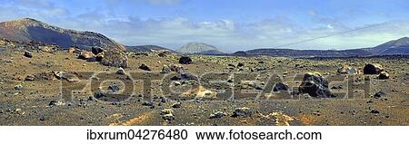 Stock Image - Caldera Colorada mit Brocken Lava in Vulkanbergen, Mancha Blanca, Lanzarote, Kanarische Insel, Spanien, Europa. Fotosearch