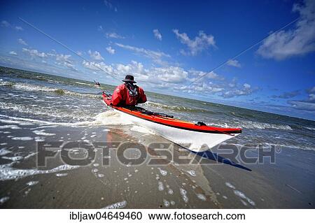Canoeist in the surf on the beach of Langeoog, East Frisian Islands, Germany, Europe View Large Photo Image Stock Image - Canoeist in the surf on the beach of Langeoog, East Frisian Islands, Germany, Europe. Fotosearch