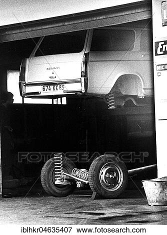 Stock Photo - Car repair shop, between 50s and 60s, exact location unknown, France, Europe. Fotosearch