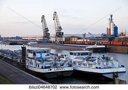 Cargo ships in the canal with cranes in Europe's largest inland port, Duisburg, Ruhr area, North Rhine-Westphalia, Germany, Europe View Large Photo Image Stock Image - Cargo ships in the canal with cranes in Europe's largest inland port, Duisburg, Ruhr area, North Rhine-Westphalia, Germany, Europe. Fotosearch