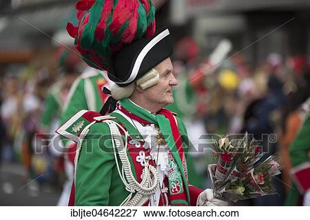 Carnival artist in green uniform with bouquet of flowers, Carnival Monday procession, Cologne, North Rhine-Westphalia, Germany, Europe View Large Photo Image Stock Photo - Carnival artist in green uniform with bouquet of flowers, Carnival Monday procession, Cologne, North Rhine-Westphalia, Germany, Europe. Fotosearch