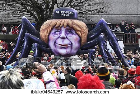 Carnival parade with theme cars by wagon builder Jaques Tilly, CDU, Angela Merkel, the black widow, Düsseldorf, North Rhine-Westphalia, Germany, Europe View Large Photo Image Stock Photo - Carnival parade with theme cars by wagon builder Jaques Tilly, CDU, Angela Merkel, the black widow, Düsseldorf, North Rhine-Westphalia, Germany, Europe. Fotosearch