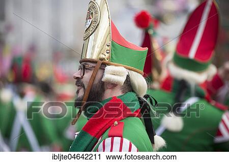Stock Image - Carnivalist in green uniform, Carnival Monday procession, Cologne, North Rhine-Westphalia, Germany, Europe. Fotosearch