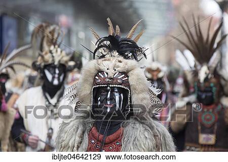 Stock Photo - Carnivalists in costume with feathers, Carnival Monday procession, Cologne, North Rhine-Westphalia, Germany, Europe. Fotosearch