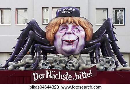 Chancellor Angela Merkel as Black Widow, sitting on the bones of her victims, political caricature, motto caravan during Carnival Monday procession 2018, Düsseldorf, North Rhine-Westphalia, Germany, Europe View Large Photo Image Stock Image - Chancellor Angela Merkel as Black Widow, sitting on the bones of her victims, political caricature, motto caravan during Carnival Monday procession 2018, Düsseldorf, North Rhine-Westphalia, Germany, Europe. Fotosearch