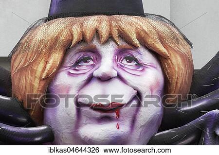 Chancellor Angela Merkel as Black Widow, blood on her lips, political caricature, motto caravan during Carnival Monday procession 2018, Düsseldorf, North Rhine-Westphalia, Germany, Europe View Large Photo Image Stock Photograph - Chancellor Angela Merkel as Black Widow, blood on her lips, political caricature, motto caravan during Carnival Monday procession 2018, Düsseldorf, North Rhine-Westphalia, Germany, Europe. Fotosearch