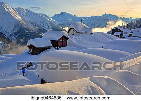 Stock Image - Chapel Maria zum Schnee in the village centre, in the back Fletschhorn 3985m, cathedral 4545m and Matterhorn 4478m, Bettmeralp, Aletsch area, Upper Valais, Valais, Switzerland, Europe. Fotosearch