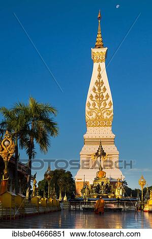Chedi of Wat Phra That Phanom, blue hour, temple complex in Amphoe That Phanom, Nakhon Phanom Province, Isan, Thailand, Asia View Large Photo Image Stock Image - Chedi of Wat Phra That Phanom, blue hour, temple complex in Amphoe That Phanom, Nakhon Phanom Province, Isan, Thailand, Asia. Fotosearch
