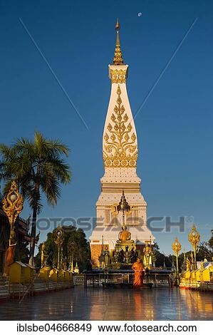 Chedi of Wat Phra That Phanom, blue hour, temple complex in Amphoe That Phanom, Nakhon Phanom Province, Isan, Thailand, Asia View Large Photo Image Stock Photo - Chedi of Wat Phra That Phanom, blue hour, temple complex in Amphoe That Phanom, Nakhon Phanom Province, Isan, Thailand, Asia. Fotosearch