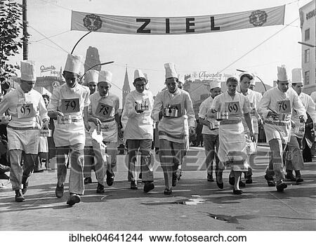 Picture - Chefs at the race with cooking pots in hand, finish line, 1960s, Berlin, Germany, Europe. Fotosearch