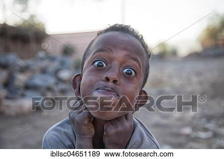 Stock Photo - Child pulls grimace, portrait, at Mekele, Region Tigray, Ethiopia, Africa. Fotosearch