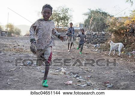 Children running on the street, near Mekele, Tigray region, Ethiopia, Africa View Large Photo Image Picture - Children running on the street, near Mekele, Tigray region, Ethiopia, Africa. Fotosearch