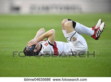Stock Photograph - Christian Gentner of VfB Stuttgart lying injured on the ground, Mercedes-Benz Arena, Stuttgart, Baden-Württemberg, Germany, Europe. Fotosearch