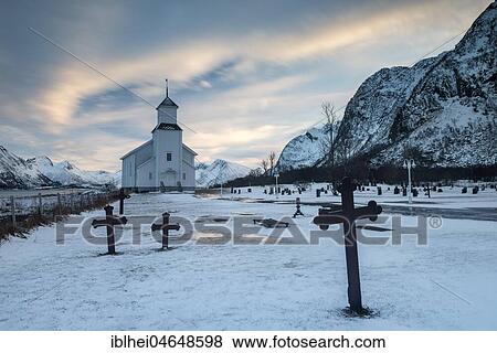 Stock Photo - Church with icy cemetery at dusk, Gimsoy, Lofoten, Norway, Europe. Fotosearch