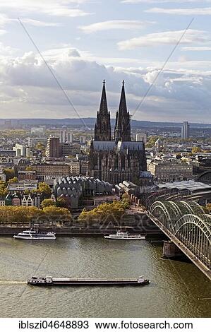 City panorama with Cologne Cathedral, Hohenzollern Bridge and Rhine, Cologne, Rhineland, North Rhine-Westphalia, Germany, Europe View Large Photo Image Stock Image - City panorama with Cologne Cathedral, Hohenzollern Bridge and Rhine, Cologne, Rhineland, North Rhine-Westphalia, Germany, Europe. Fotosearch