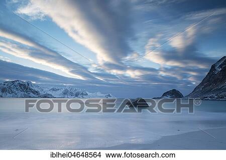 Picture - Cloudy atmosphere on the icy beach of Haukland, Lofoten, Norway, Europe. Fotosearch