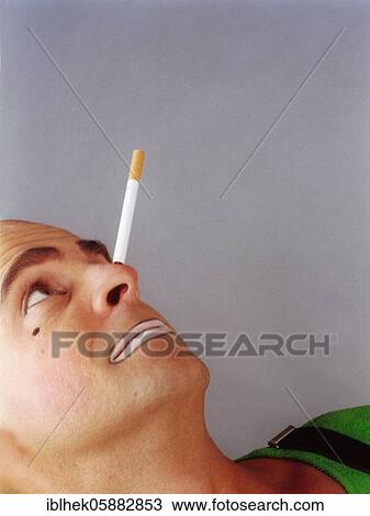 Clown balances cigarette on his nose, Berlin, Germany, Europe View Large Photo Image Stock Image - Clown balances cigarette on his nose, Berlin, Germany, Europe. Fotosearch