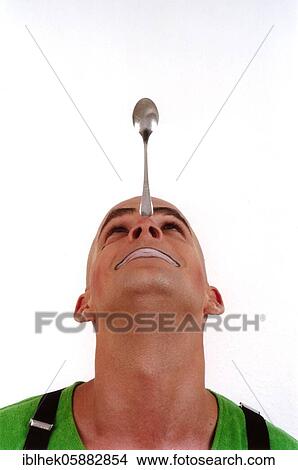 Clown balances spoons on his nose, Berlin, Germany, Europe View Large Photo Image Picture - Clown balances spoons on his nose, Berlin, Germany, Europe. Fotosearch