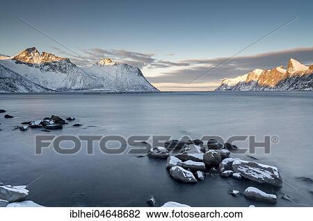 Stock Image - Coastal landscape at dusk, Mehjfjord Brygge, Senja, Norway, Europe. Fotosearch