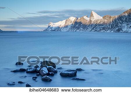 Stock Image - Coastal landscape at dusk, Mehjfjord Brygge, Senja, Norway, Europe. Fotosearch