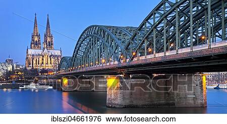Cologne Cathedral with Hohenzollern Bridge at dusk, Cologne, North Rhine-Westphalia, Germany, Europe View Large Photo Image Stock Photograph - Cologne Cathedral with Hohenzollern Bridge at dusk, Cologne, North Rhine-Westphalia, Germany, Europe. Fotosearch