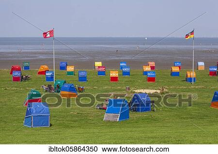 Colourful beach chairs at the green beach at the Outer Elbe, North Sea spa Otterndorf, Lower Saxony, Germany, Europe View Large Photo Image Stock Image - Colourful beach chairs at the green beach at the Outer Elbe, North Sea spa Otterndorf, Lower Saxony, Germany, Europe. Fotosearch