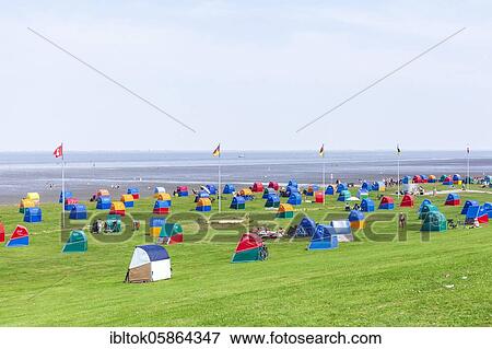 Colourful beach chairs at the green beach at the Outer Elbe, North Sea spa Otterndorf, Lower Saxony, Germany, Europe View Large Photo Image Stock Photo - Colourful beach chairs at the green beach at the Outer Elbe, North Sea spa Otterndorf, Lower Saxony, Germany, Europe. Fotosearch