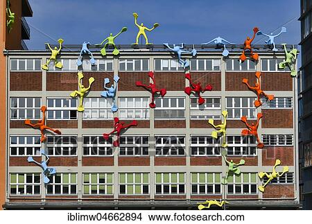 Picture - Colourful Flossi figures at the Roggendorf House, Medienhafen, Düsseldorf, North Rhine-Westphalia, Germany, Europe. Fotosearch