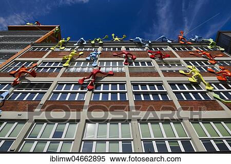 Colourful Flossi figures at the Roggendorf House, Medienhafen, Düsseldorf, North Rhine-Westphalia, Germany, Europe View Large Photo Image Stock Photography - Colourful Flossi figures at the Roggendorf House, Medienhafen, Düsseldorf, North Rhine-Westphalia, Germany, Europe. Fotosearch