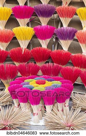 Stock Image - Colourful incense sticks for sale, Hue, Vietnam, Asia. Fotosearch